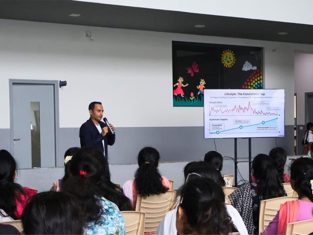 Rrishi Barman speaking to a seated audience about the L.I.F.E. Formula
