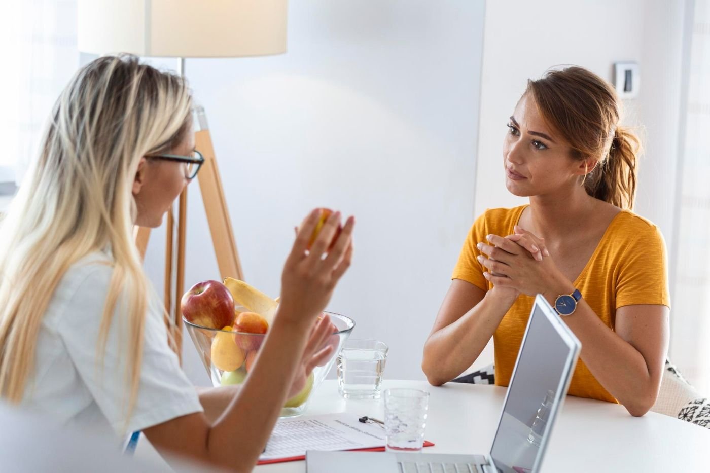 Wellness professional reviewing a personalized plan with a client