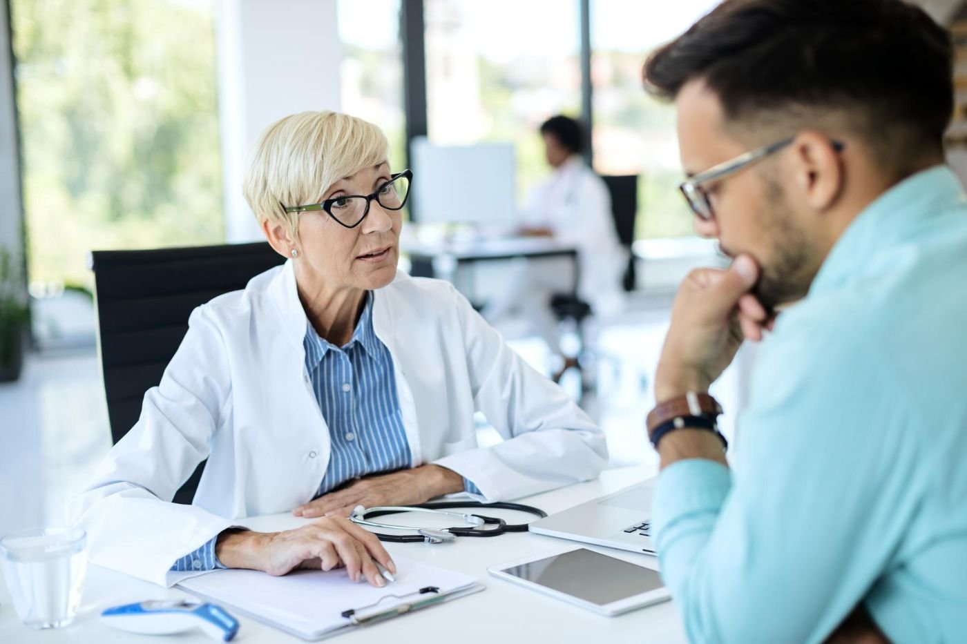 A doctor discussing results with a patient in a clinic